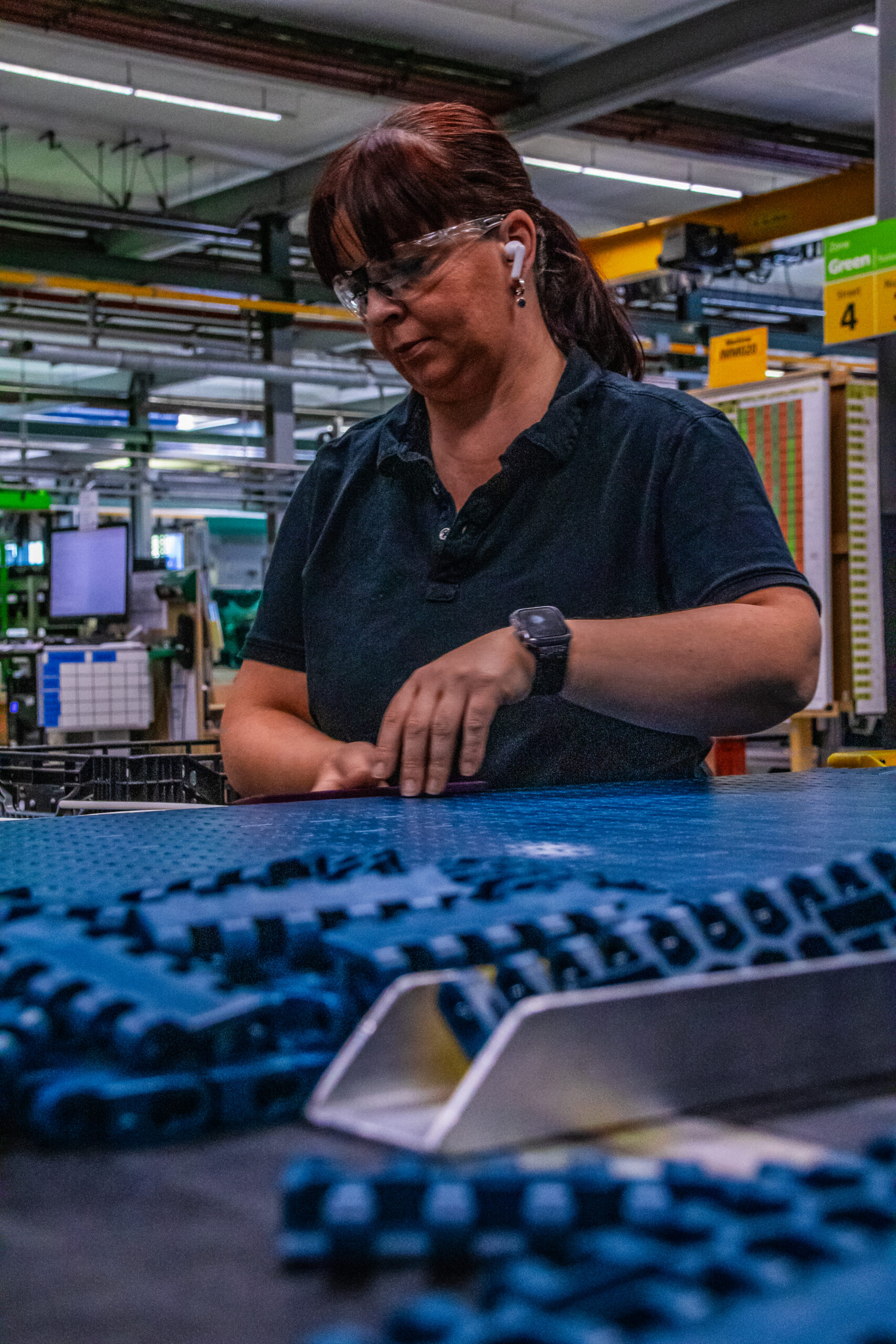 Worker assembling conveyor components